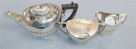 A George V demi fluted silver three piece tea set, Mappin & Webb, Sheffield, 1918/9, gross 22.5 oz.